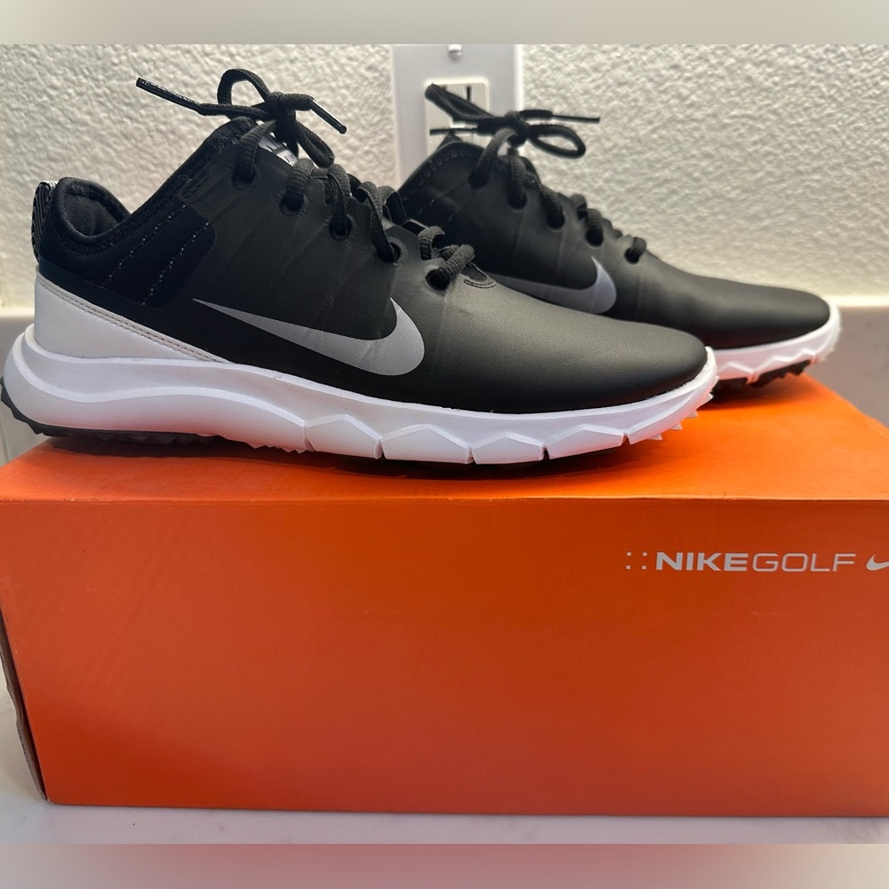 Black women’s Nike golf shoes